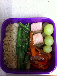 Bento box #1: brown rice, sesame/soy green beans on top of celery kinpira, salmon cubes, carrot kinpira, sweet pepper and onion confit, and fresh grapes