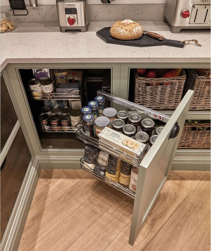 Metal pullout shelf in cupboard