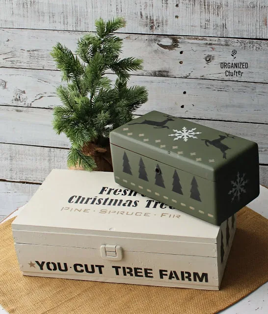 Photo of two thrifted boxes painted and stenciled as Christmas decor