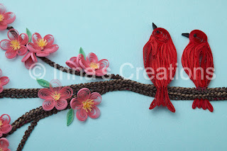 Quilled birds, sitting