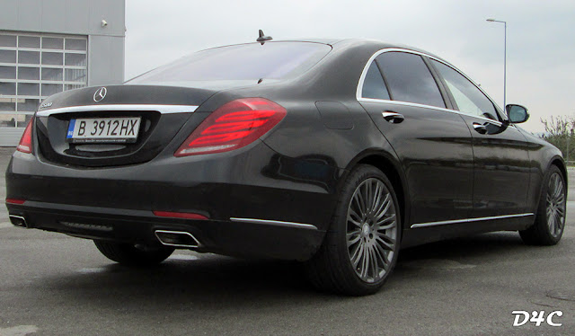 The 2014 Mercedes S500 - rear and side view.