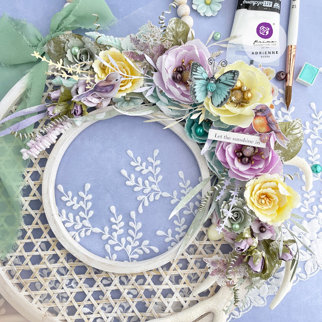 Woven wood wreath form decorated with Prima Marketing In Full Bloom collection flowers, ribbon, ephemera and Redesign with Prima Moulds.