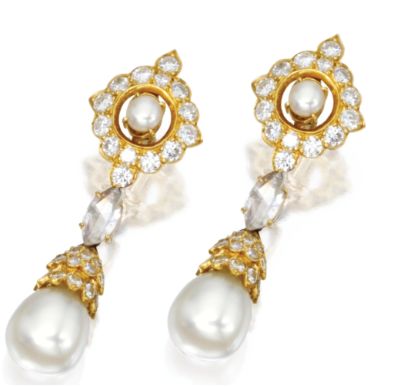 Pearl and diamond earclips set in gold reminiscent of the 1980's flamboyant