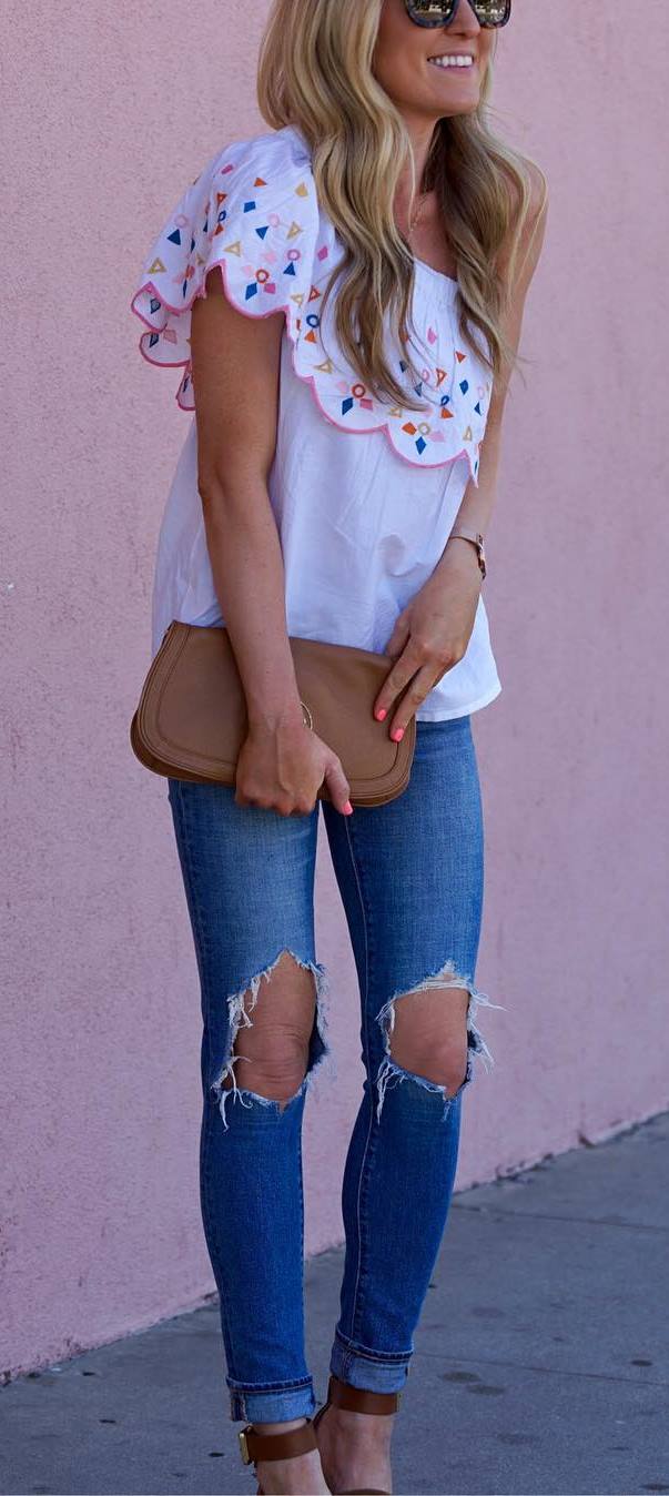 casual outfit idea top + ripped jeans + bag