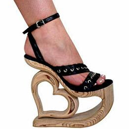 High-heeled footwear (often