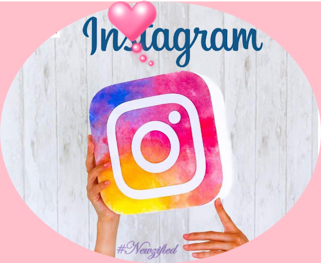 female-hand-holding-up-the-instagram-logo-#newzified