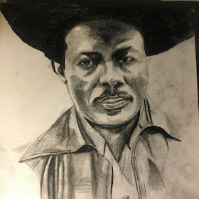 The cover is a pencil or charcoal drawing of I-Roy in a large hat and collared shirt.