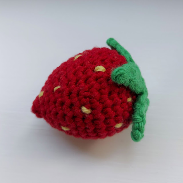 A cute crochet strawberry for a child's play kitchen