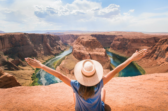 https://www.pexels.com/photo/woman-sitting-on-cliff-overlooking-mountain-3279885/