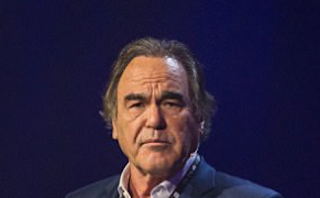 'Two of a kind!' Former Playboy Playmate accuses Oliver Stone of groping her breast after the film director defended Harvey Weinstein