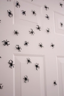 Plastic Spiders on Front Door by Delia Creates