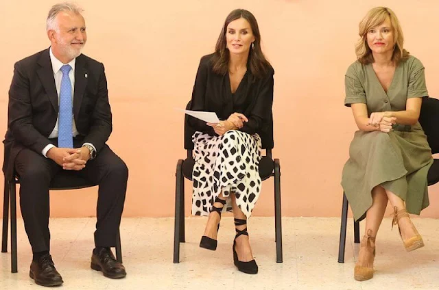 Queen Letizia and Kate Middleton wore a same two-tone skirt by Massimo Dutti. Letizia wore a v-neck silk shirt by Sandro