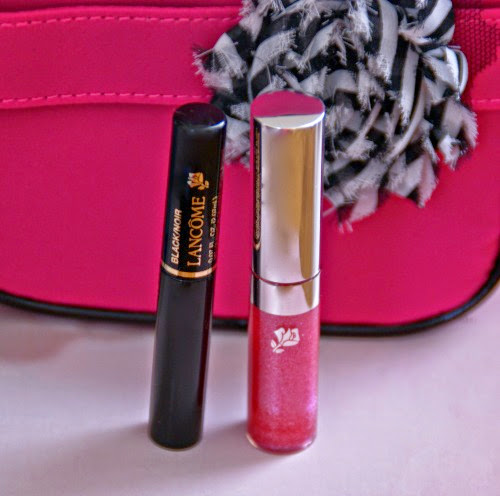 Lancome black mascara and pink sparkly lip gloss