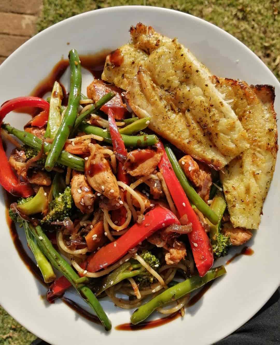 Chicken stir fry served with oven baked hake