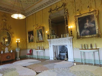 wide view of room with yellow silk walls