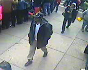 Subject #1 is in the fore. Subject #2, who is wearing a white cap, . (boston suspect and suspect)