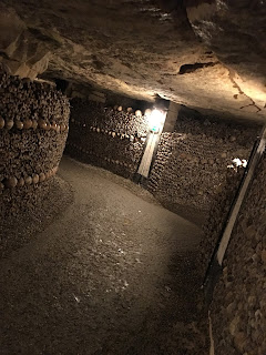 traveling solo female woman wanderlust europe backpack paris france catacombs