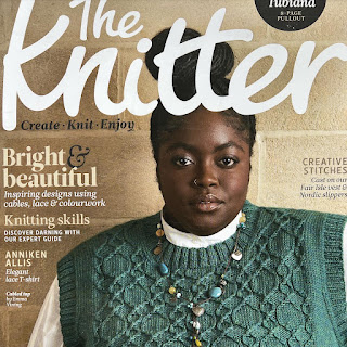 Magazine cover with a model wearing a hand knitted top