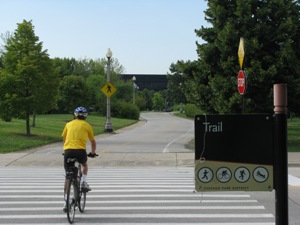 Bicyclist crossing Waldron Drive on the Lakefront Trail in Chicago, Illinois