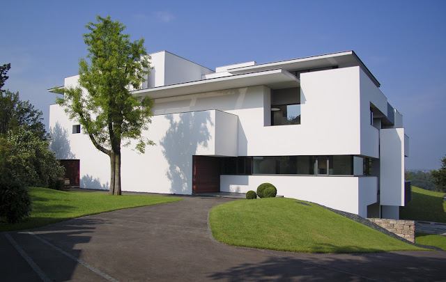 Photo of an amazing home as seen from the backyard