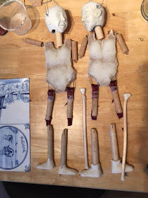 two puppets / marionettes in the making. Showing wooden bodies and sculpted heads  By Corina Duyn