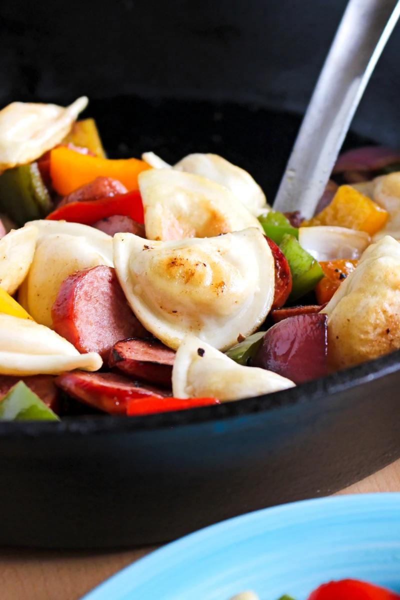 Kielbasa, Pepper, Onion, and Pierogy Hash is a simple and easy to prepare recipe that is on the table in less than 30 minutes. It's the perfect family meal for busy days!