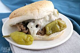 It only takes 4 ingredients & a few minutes of prep to make this juicy and flavorful Slow Cooker Italian Pepperoncini Shredded Beef.