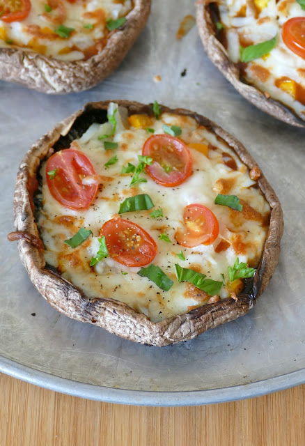 This easy and delicious low carb lunch or dinner recipe is vegetarian, but it would be even more delicious by adding sausage, pepperoni, ham or chicken! Customize with your favorite pizza toppings, herbs or cheese! These portobello mushroom pizzas are a perfect weeknight meal!