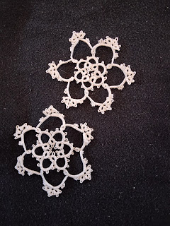2 tatted snowflakes, identical except for length of chains in 2nd (outer) round.