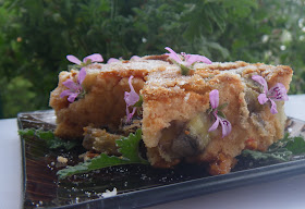 Banana Fruit Bread garnished with rose scented pelargonium flowers and leaves