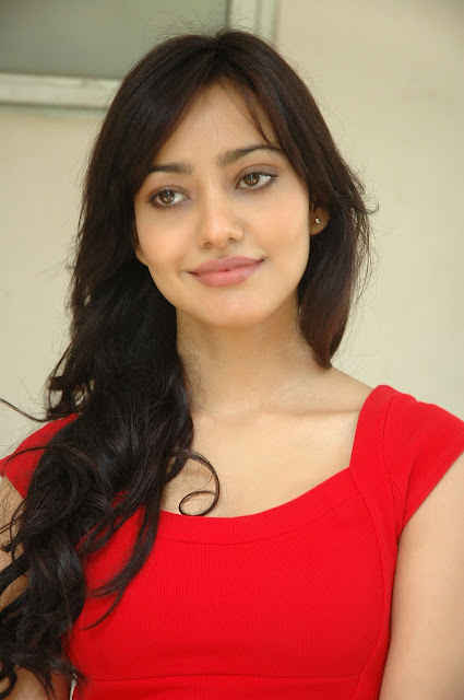 Neha Sharma looking sexy in red dress