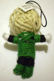 Back of vending machine mini Green Lantern string puppet