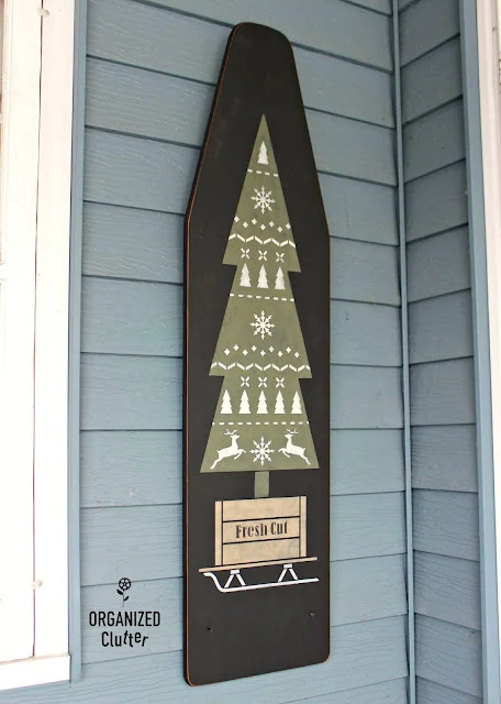 Photo of a Christmas Sweater Tree stenciled on an ironing board.