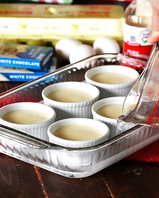 Pouring Water into Baking Dish to Create a Water Bath Image