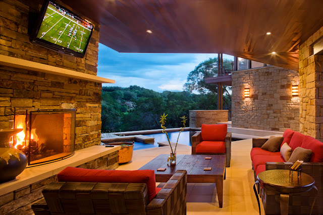 Photo of covered terrace with tv and fireplace