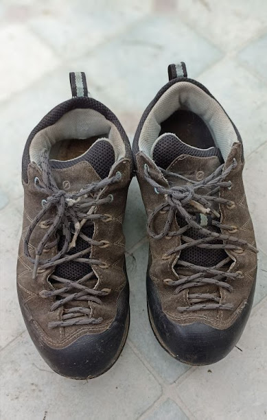 A pair of well-worn walking shoes