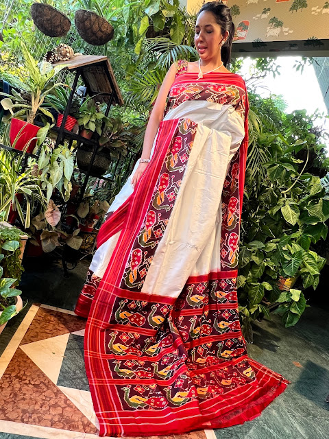 Cream & red pochampally saree with peacock motifs