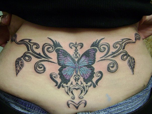 lower back butterfly tattoo. tattoos at the lower back