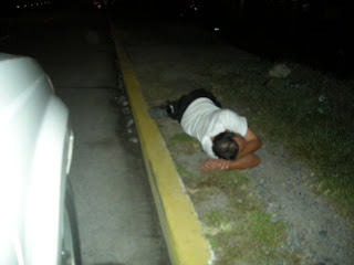 drunk man sleeping it off by the road