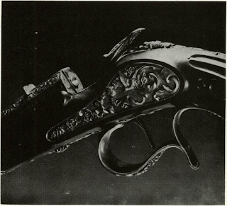 Flobert bulleted-breech cap .22 used in "saloon pistol" of 1845 was predecessor of cartridge which made Henry rifle practical. French design was known to Horace Smith, inventor who had hand in evolution of perfected Winchester-built Henry Civil War rifle. Flobert gun shown had rib on hammer face to ensure complete ignition of inside priming by denting entire diameter of cartridge base.