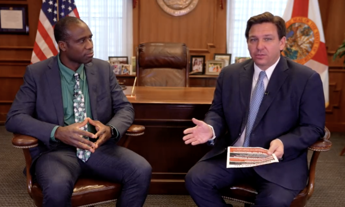 Florida Surgeon General Joseph Ladapo (L) and Florida Gov. Ron DeSantis at the governor's office in Tallahassee on Feb. 24, 2022, in a still from video.