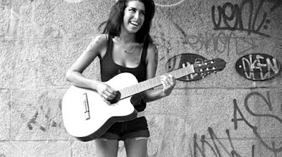 A Still from Asif Kapadia's Amy, playing Guitar