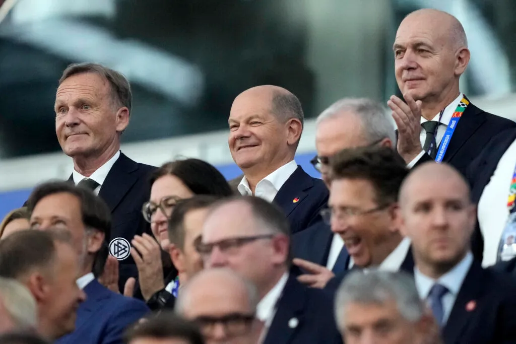 German Chancellor Olaf Scholz, center top, cheers for his national team before a Group A match between Switzerland and Germany at the Euro 2024 soccer tournament in Frankfurt, Germany, Sunday, June 23, 2024.