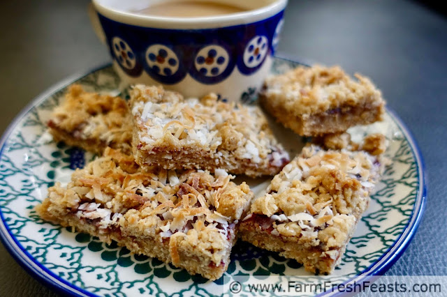 These tasty bar cookies have a raspberry jam filling sandwiched between layers of buttery oatmeal and toasted coconut crust.