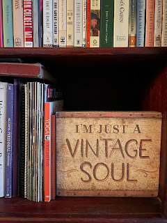 Vintage sign in a book shelf