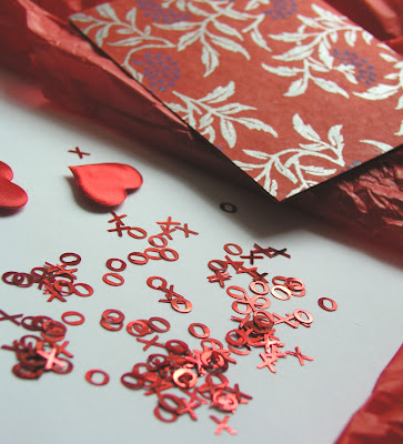 lots of hugs and kisses, hearts and pretty red wrapping