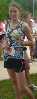 Picture of me on race day (after the race) with my trophy!