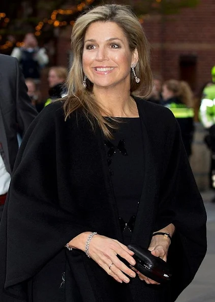 Queen Maxima in Rotterdam. Queen wore Natan Dress, Christian Louboutin pumps, diamond gold earrings, new winter dress
