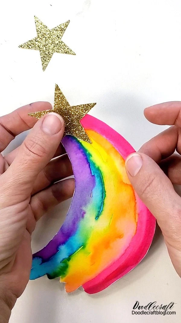 And then glue the other star on the backside of it to add stability. You could also paint the other side of the paper before gluing, to make the cake topper reversible or beautiful from both sides.