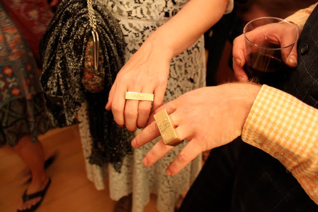 Yes those are twofinger gold wedding rings inscribed with Mr on his and 